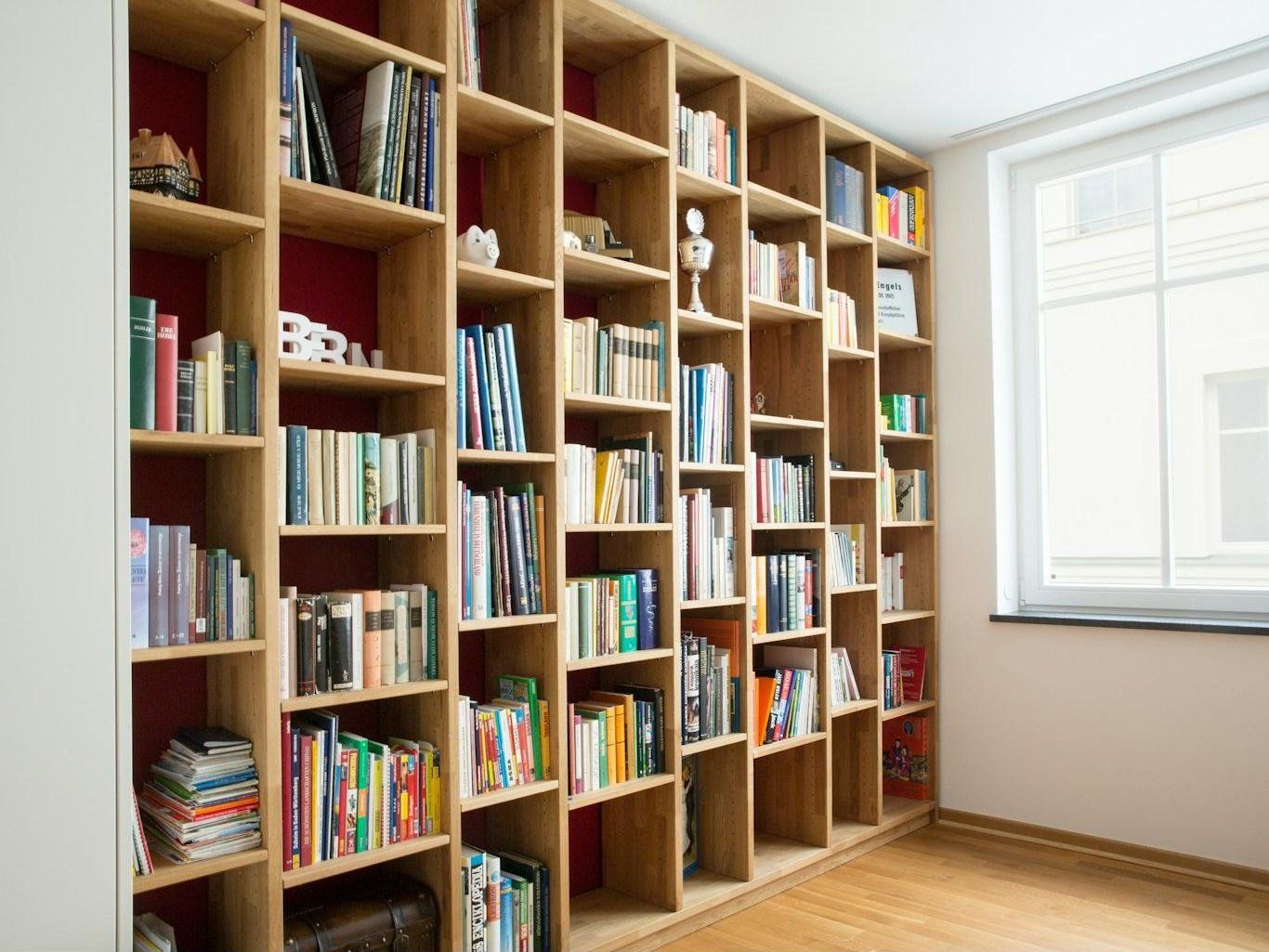 Floor-to-ceiling built-in bookshelves in a study