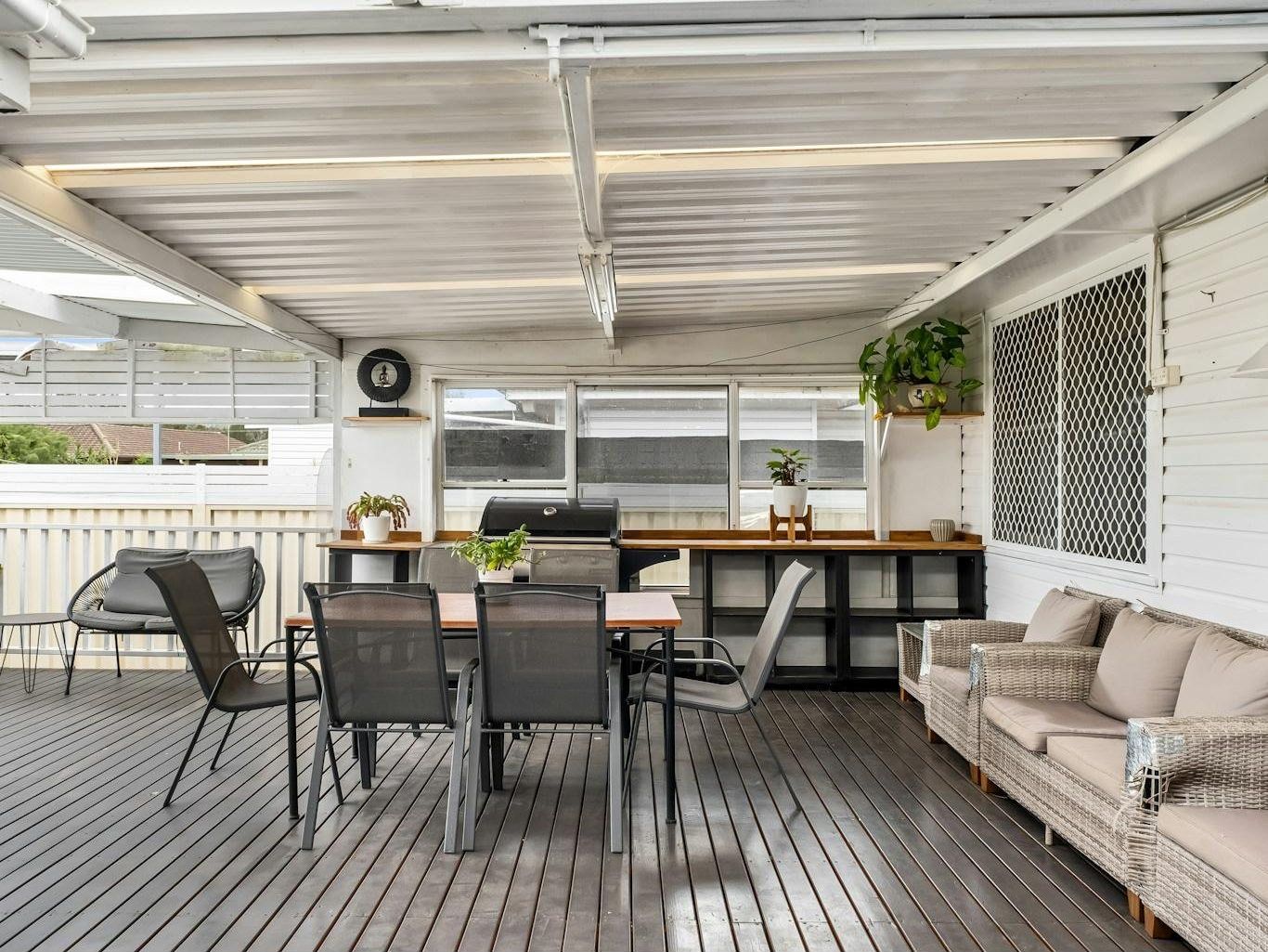 Rear alfresco extension with raked timber ceiling and stacker doors