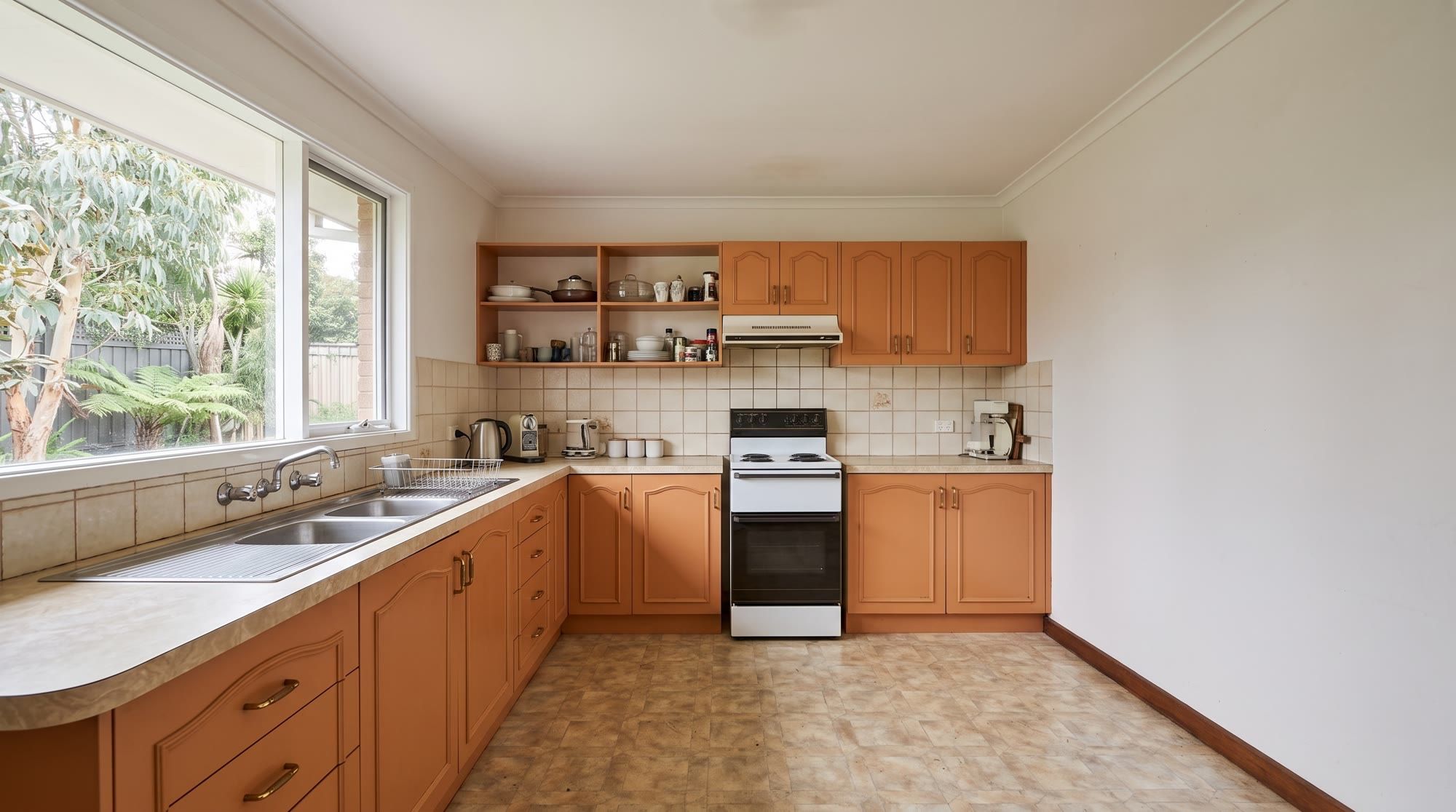 Dated closed-in kitchen before the renovation